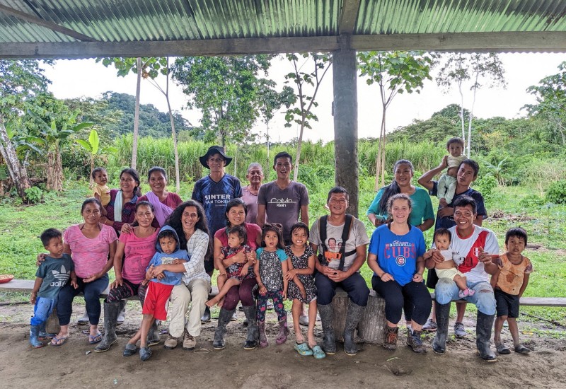 Local community who restores trees poses in a group picture  in Ecuador