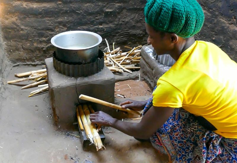 Local woman working with high efficiency cookstoves