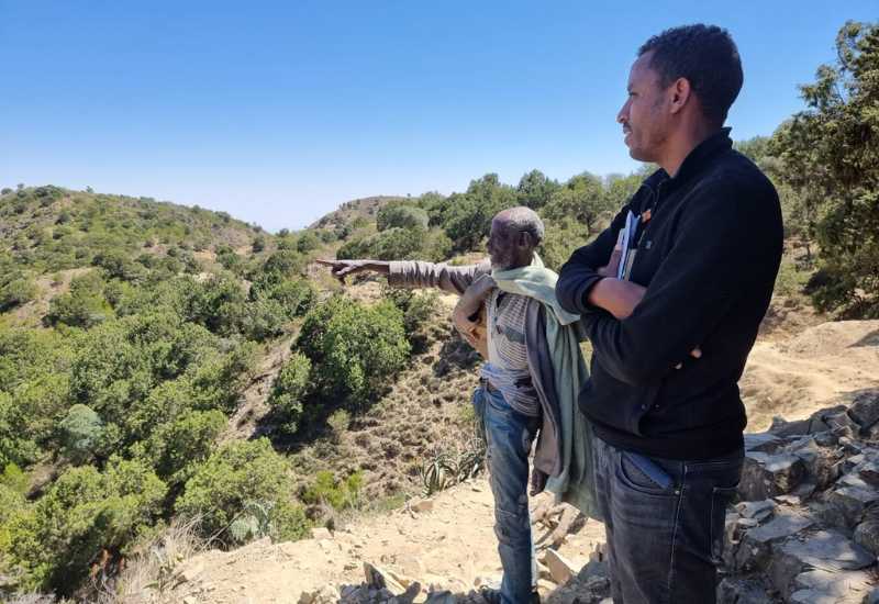 Local community examining project site in Ethiopia