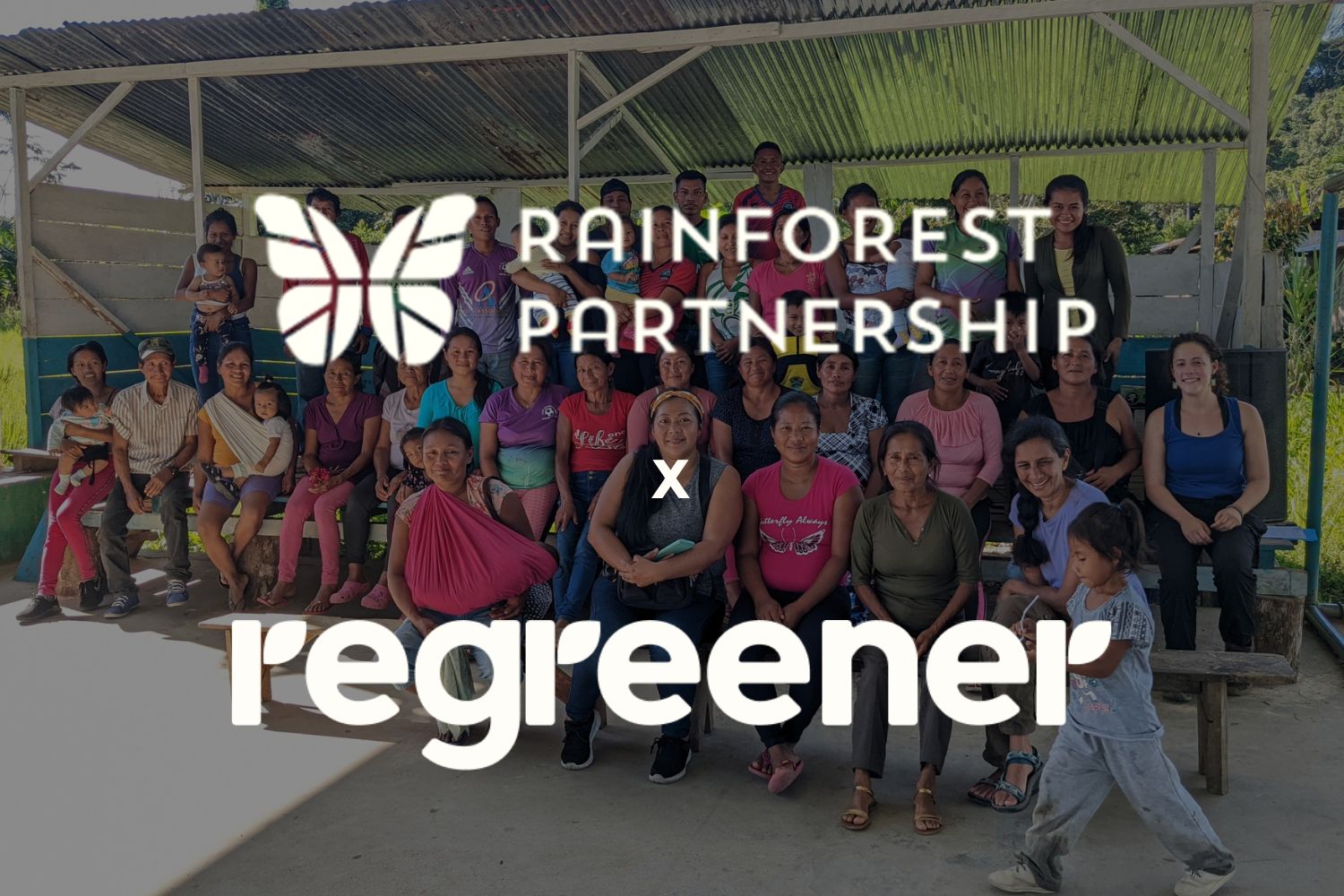 Community workers in Ecuador posing for a group picture with Rainforest Partnership & Regreener logo