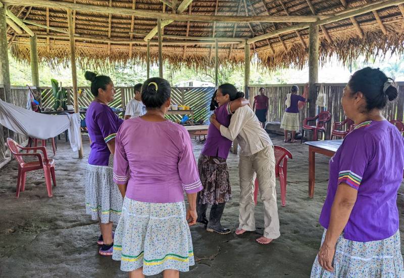 Local community workers in a gathering meeting the CEO of Rainforest Partnership