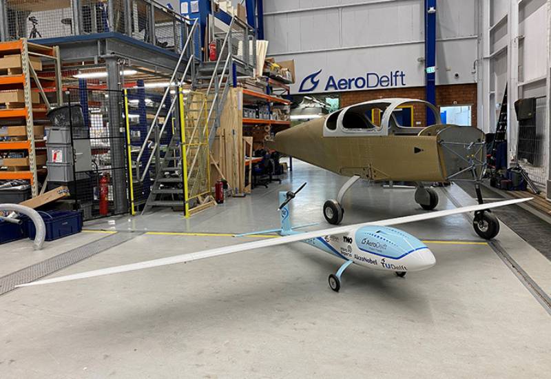 Model plane fuelled with liquid hydrogen in factory hall